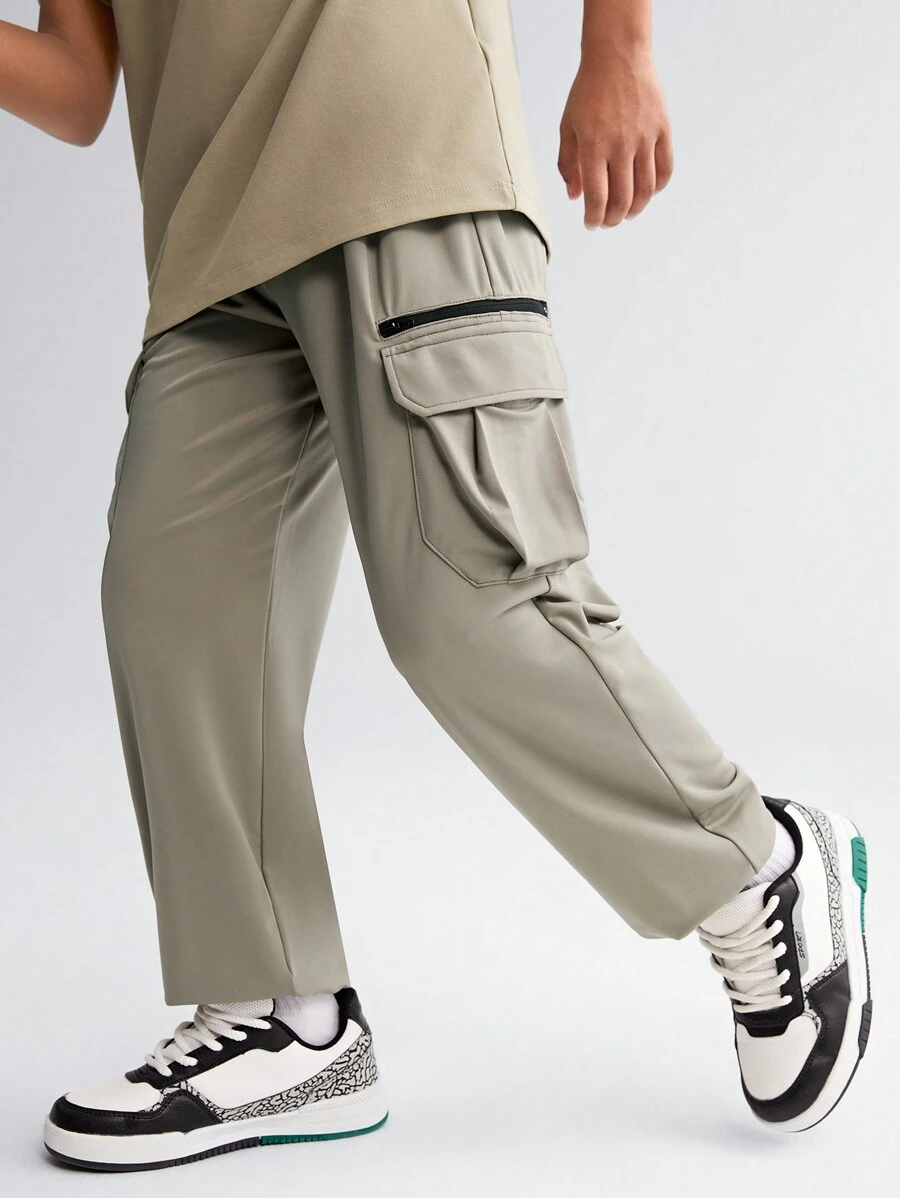 SHEIN Tween Boy Solid Color Woven Pants With Zipper Pockets, Printed Pattern And Elastic Cuffs