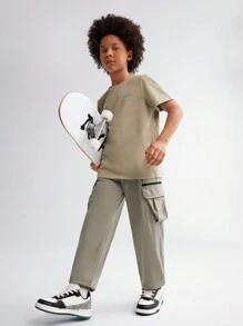 SHEIN Tween Boy Solid Color Woven Pants With Zipper Pockets, Printed Pattern And Elastic Cuffs