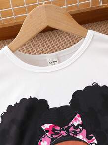 少女卡通印花短袖上衣和迷彩印花短裤两件套，夏季