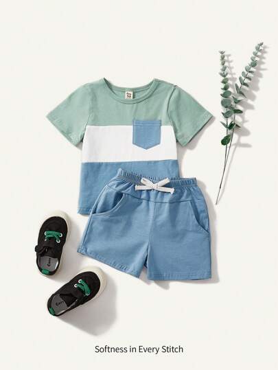 Cozy Pixies طقم صبياني للرضع من بلوزة قصيرة بيضاء وأزرق وشورت رياضي