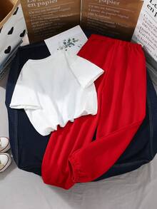 SHEIN Conjunto de dos piezas para niños preadolescentes con top de cuello redondo de manga corta con estampado de tigre casual y pantalones largos de punto lisos - Multicolor - Ver 2