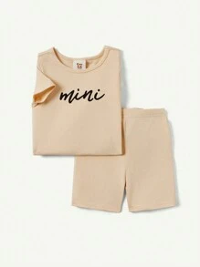 Cozy Pixies Baby Girl Snug Fit Pajama Set, Including A Short-Sleeved Crew-Neck Top And Shorts With Alphabet Pattern
