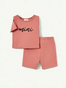 Cozy Pixies Baby Girl Snug Fit Pajama Set, Including A Short-Sleeved Crew-Neck Top And Shorts With Alphabet Pattern