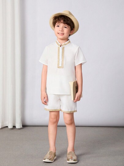 Młody chłopiec dwa elementy zestaw z łączenia taśmy tkanej krótki rękaw koszula i spodenki