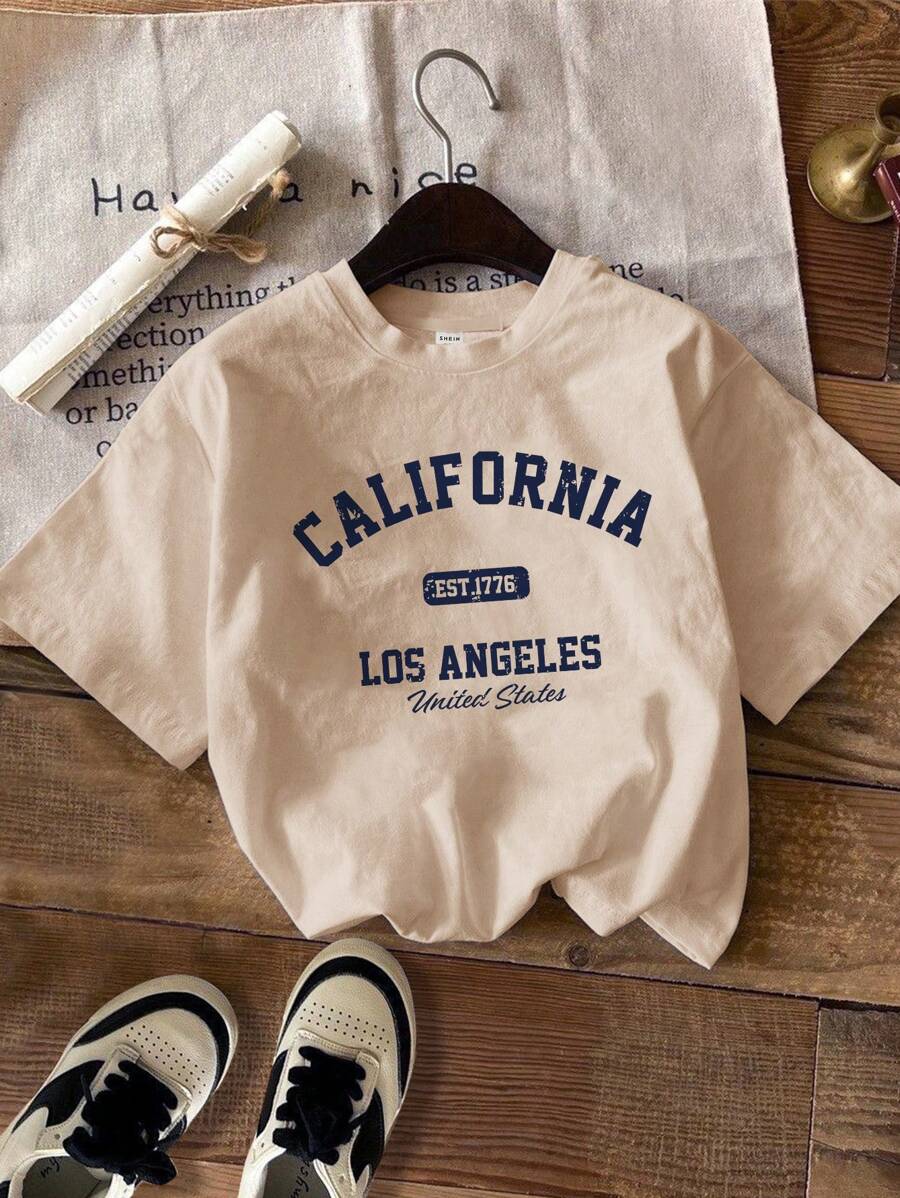 SHEIN EZwear تيشرت قصير الأكمام بياقة مستديرة مع طباعة إنجليزية كبيرة ، تيشرت مريح فضفاض مناسب للنساء للصيف - لون مشمشي - مشاهدة 1