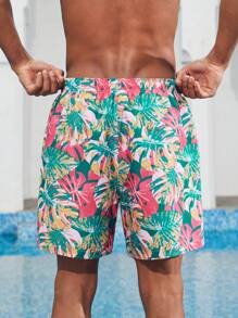 Manfinity 1 pieza Pantalón corto de verano de hombre con estampado de hojas sueltas, traje de baño a juego para parejas, vacaciones estilo hawaiano