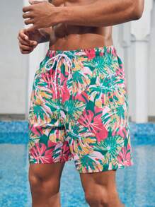 Manfinity 1 pieza Pantalón corto de verano de hombre con estampado de hojas sueltas, traje de baño a juego para parejas, vacaciones estilo hawaiano