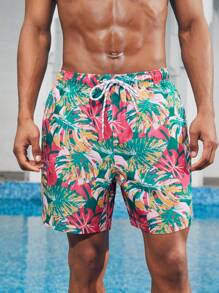 Manfinity 1 pieza Pantalón corto de verano de hombre con estampado de hojas sueltas, traje de baño a juego para parejas, vacaciones estilo hawaiano