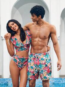 Manfinity 1 pieza Pantalón corto de verano de hombre con estampado de hojas sueltas, traje de baño a juego para parejas, vacaciones estilo hawaiano