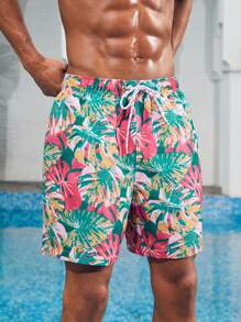 Manfinity 1 pieza Pantalón corto de verano de hombre con estampado de hojas sueltas, traje de baño a juego para parejas, vacaciones estilo hawaiano