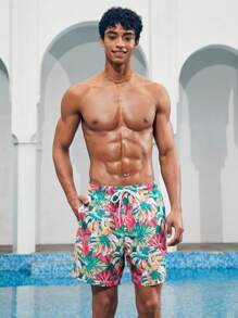 Manfinity 1 pieza Pantalón corto de verano de hombre con estampado de hojas sueltas, traje de baño a juego para parejas, vacaciones estilo hawaiano