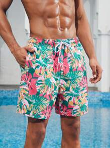 Manfinity 1 pieza Pantalón corto de verano de hombre con estampado de hojas sueltas, traje de baño a juego para parejas, vacaciones estilo hawaiano