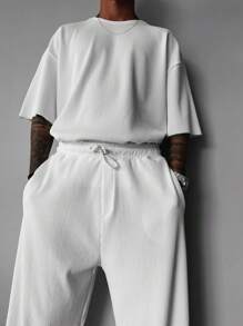 Camiseta de cuello redondo de verano para hombre con mangas cortas caídas en unicolor