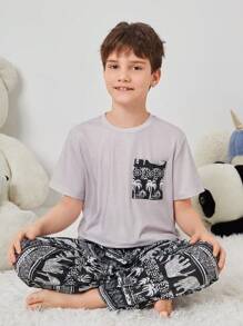 SHEIN Tween Boy Tween Girl Vintage Pattern Print Short Sleeve Top And Long Pants Knit Comfortable Casual Sleepwear Set With Pockets And Flame Retardant Features
