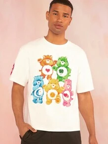 SHEIN X Care Bears Camiseta blanca de manga corta floja casual para hombre con estampado de oso Care Bear de patrón veraniego y divertido de dopamina - Blanco - Ver 1