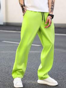 Manfinity EMRG Pantalones casuales rectos de pierna recta para hombres con cintura ajustable con cordón en color verde fluorescente para uso diario