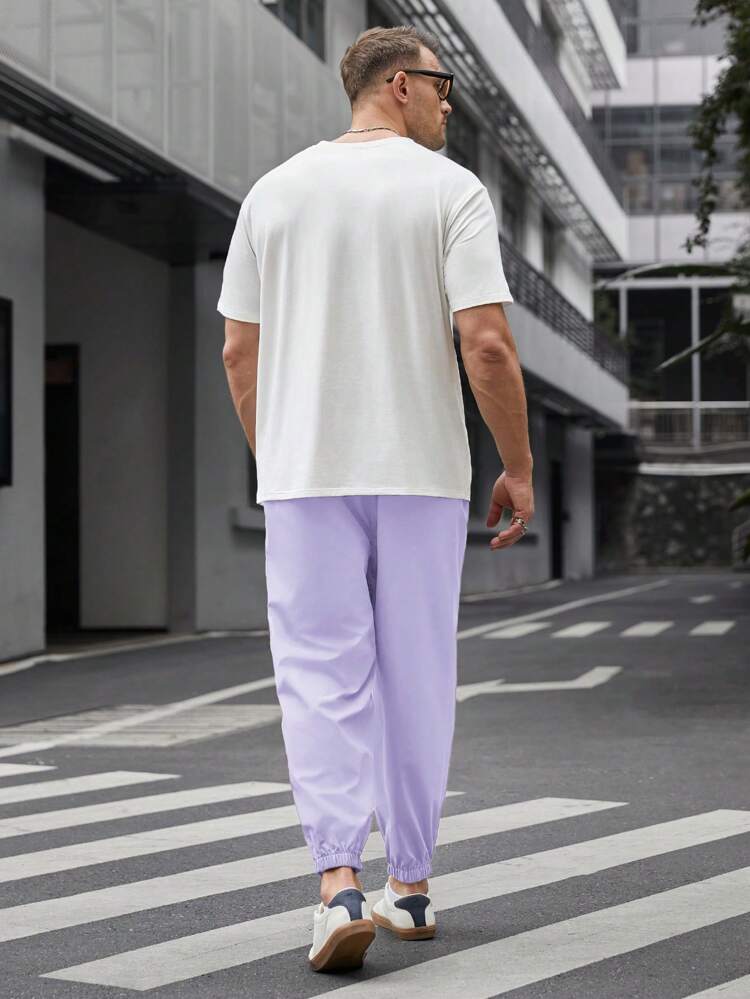 Men Plus Size Letter Printed Short Sleeve T-Shirt With Drawstring Hem And Jogger Pants Casual Two Pieces Set For Spring And Summer