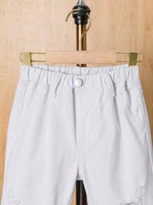 Shorts de mezclilla holgados y desgastados para niño joven en verano