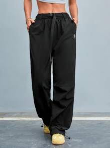 SHEIN Sports Pantalones deportivos rectos para mujer con cinturón y bolsillos en unicolor