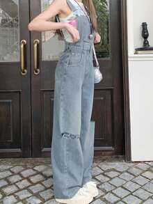 女士休闲紧身破洞牛仔背带裤