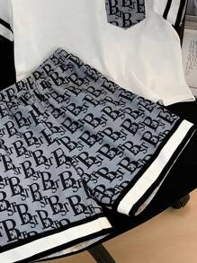 SHEIN Young Boy Casual Printed Pocket Round Neckline Short Sleeve T-Shirt And Printed Shorts Knitted Two-Piece Set With Woven Belt