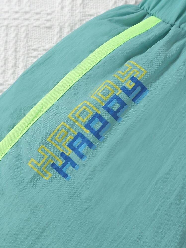 2pcs/Set Infant Boys' Fashionable And Cute Colorblocked Shorts With Elastic Waistband, One Pair In Beige With Blue Details And Letter Print, The Other In Dark Green With Light Green Details And Pattern Print, For Spring/Summer