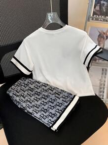 SHEIN Young Boy Casual Printed Pocket Round Neckline Short Sleeve T-Shirt And Printed Shorts Knitted Two-Piece Set With Woven Belt