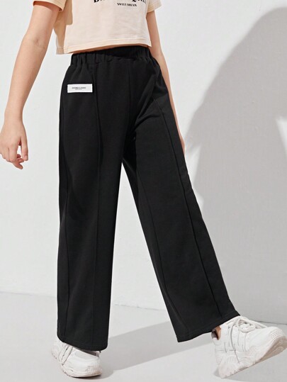 بنطلون بناتي واسع الساقين يتميز بتفاصيل الرقع