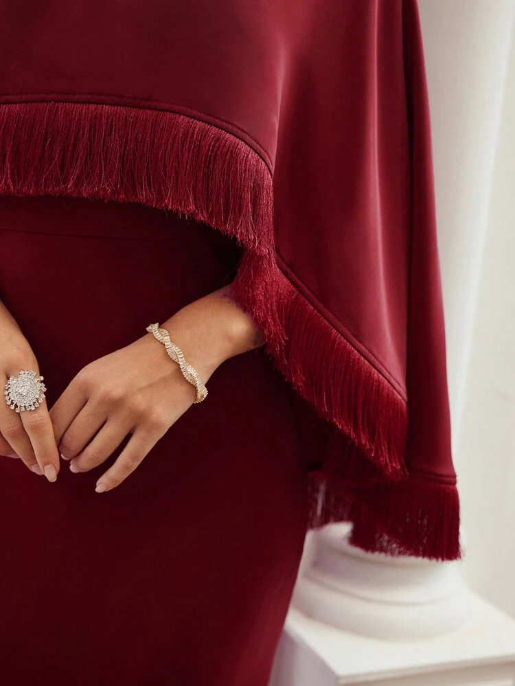 SOLID FRINGE TRIM MERMAID HEM CAPE DRESS