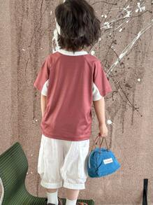 Conjunto de 2 piezas para niño joven que incluye camiseta de cuello redondo con impresión de letras y mangas cortas con pantalones sólidos de bolsillos en bloqueo de color - Negro - Ver 2