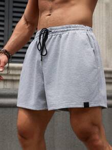 Manfinity Homme Pantaloncini uomo taglia forte con coulisse in vita e tasche, colore unito e vestibilità ampia, casual - Grigio Chiaro - Visualizzare 1
