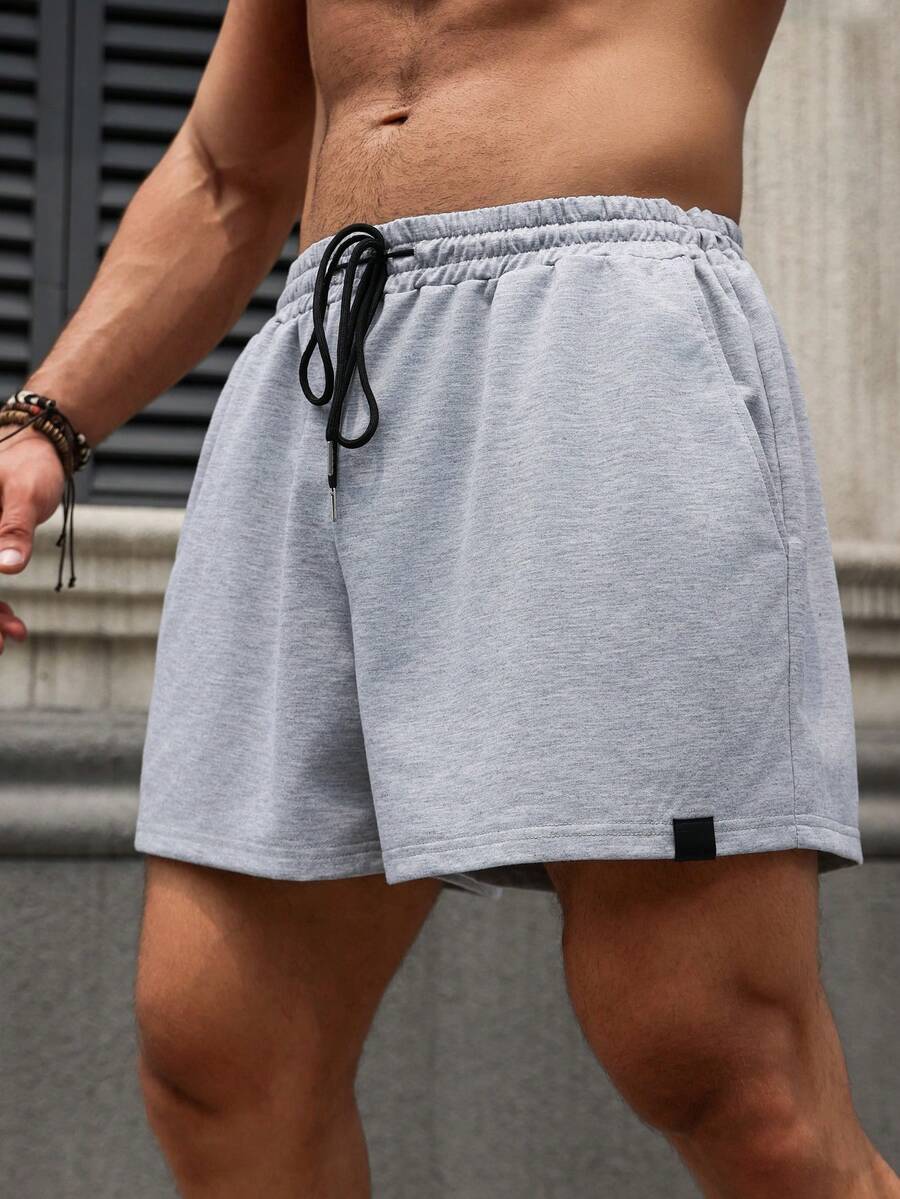 Manfinity Homme Pantaloncini uomo taglia forte con coulisse in vita e tasche, colore unito e vestibilità ampia, casual - Grigio Chiaro - Visualizzare 1