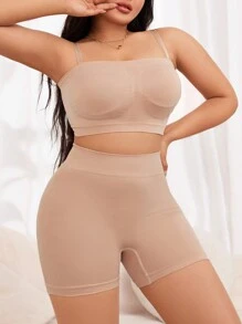 Conjunto reductor simple y liso de chaleco y leggings en talla grande