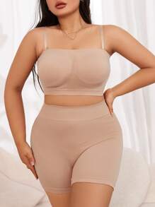 Conjunto reductor simple y liso de chaleco y leggings en talla grande