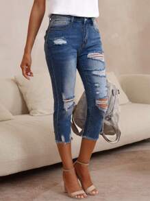 Pantalones capri de mezclilla rasgados ajustados para damas