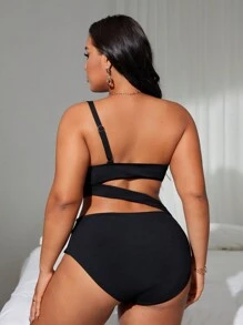 Traje de baño de una pieza de talla grande en un solo color con escote asimétrico y detalles agujereados, perfecto para la playa y la piscina - Negro - Ver 2