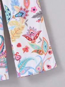 Conjunto de blusa sin mangas con estampado floral y pantalones de pierna ancha para niña joven con adornos de borlas para vacaciones