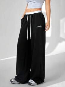 Coolane Women's Solid Color Patchwork Front Tie Pocket Casual Pants, For Daily Wear - Black and White - View 1