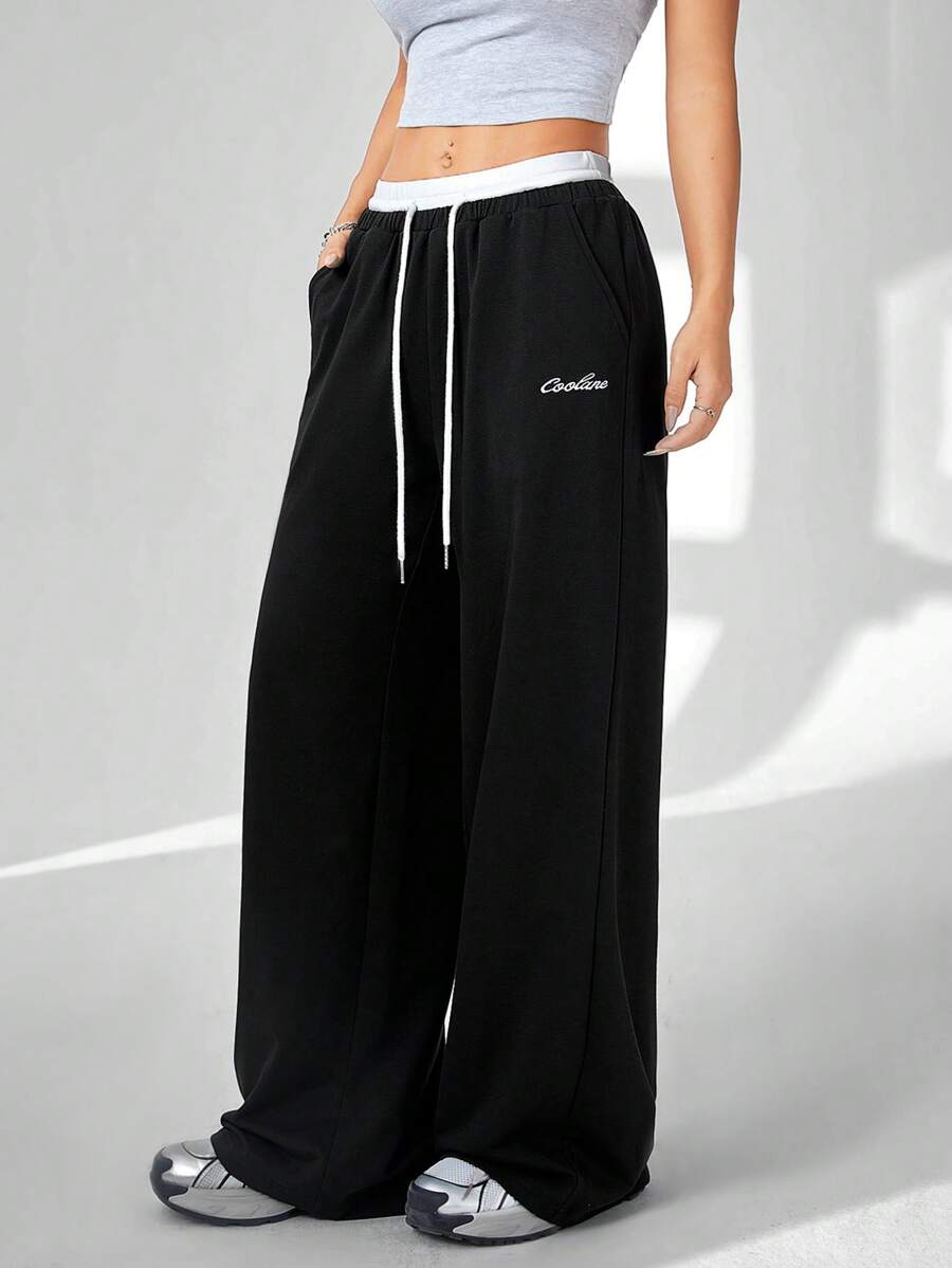 Coolane Women's Solid Color Patchwork Front Tie Pocket Casual Pants, For Daily Wear - Black and White - View 1