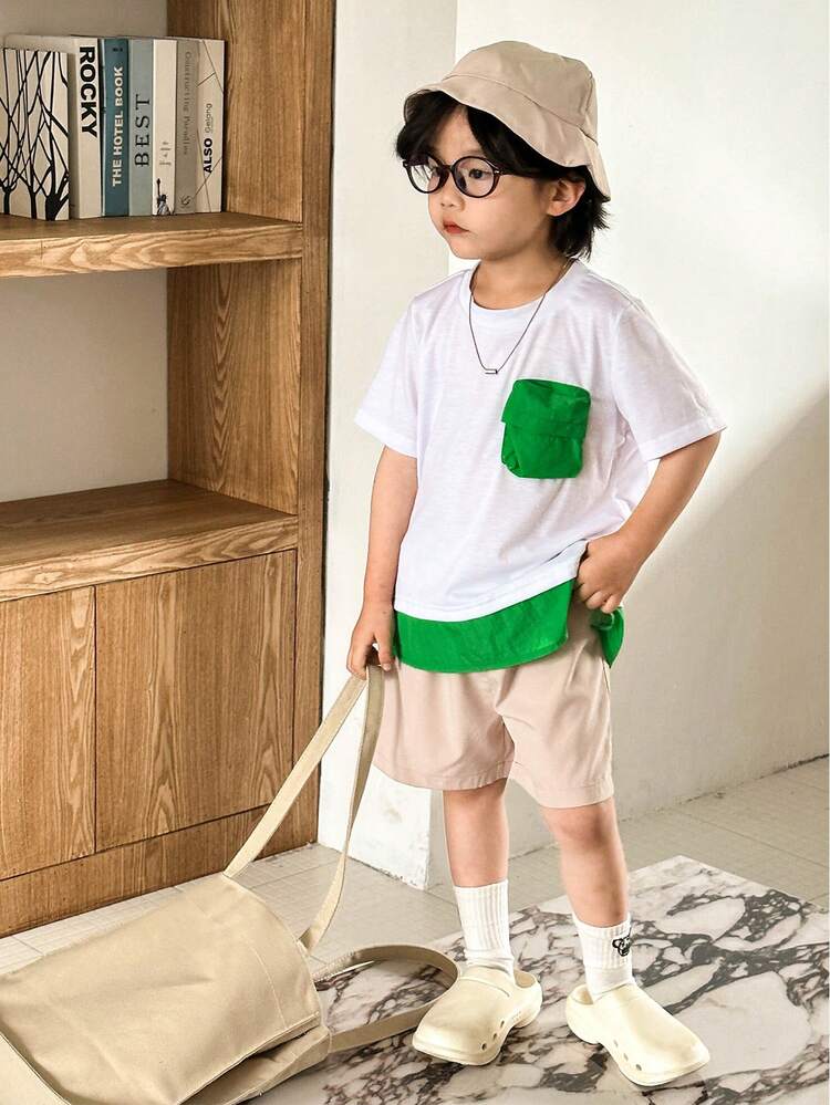 3pcs/Set Young Boy Color Block Round Neck 3D Workwear Pocket Shirt With Hem Split Design, Breathable Shorts And Sun-Protective Bucket Hat, Suitable For Vacation And Daily Wear