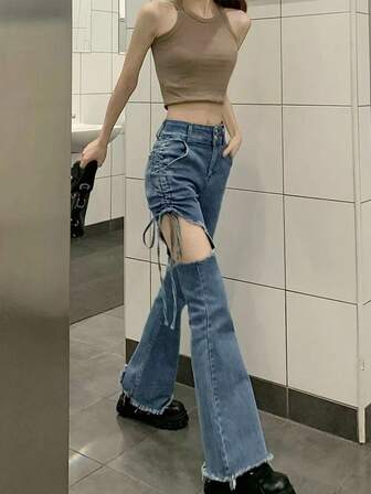 女士时尚镂空抽绳磨边喇叭裤脚牛仔裤