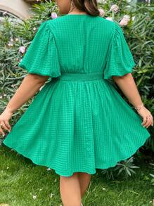 Dreamara Vestido de línea A con cuello en V y mangas cortas hecho de tela con textura para vacaciones