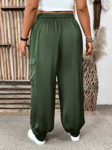 Plus Size Solid Color Drawstring Waist Casual Tapered Pants With Pockets