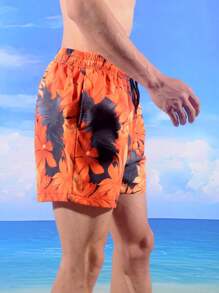Manfinity Bermudas de playa holgadas para hombre con estampado de plantas tropicales y cintura elástica con cordón, vacación