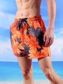 Manfinity Bermudas de playa holgadas para hombre con estampado de plantas tropicales y cintura elástica con cordón, vacación