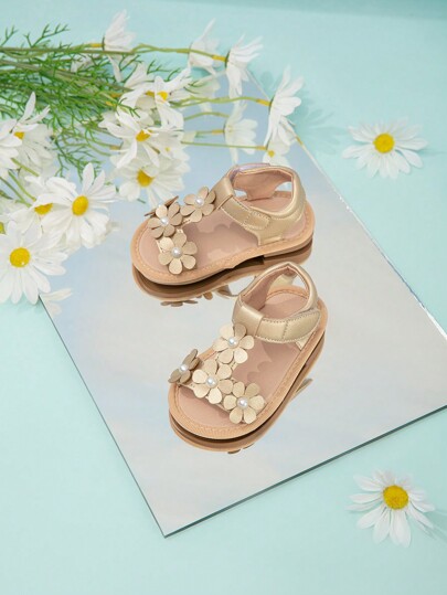 Sandalias de playa decoradas con flores doradas lindas para bebés y niños pequeños