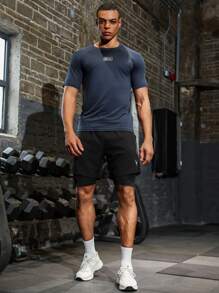 Manfinity Sport Corelite Camiseta de tirantes deportiva de estilo boyfriend para hombre, de corte ajustado, cómoda y transpirable, para el verano