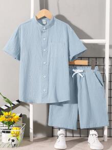 SHEIN Conjunto casual cómodo para niño preadolescente de camiseta de manga corta de unicolor y pantalones cortos