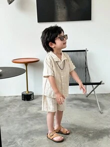 SHEIN This 2-Piece Set Of Textured Woven Shirt And Shorts For Young Boys Is A Combination Of Quality And Fashion. The Shirt Is Made Of Textured Woven Fabric, With A Delicate Feel And Comfortable Texture. The Design Is Focused On Details And Texture Processing, Displaying A Unique Fashion Style. The Shorts Are Made Of Comfortable Fabric, With A Simple And Casual Design, Suitable For Boys To Wear. The Whole Set Has A Unified Style, With Coordinated Color Matching, Displaying An Overall Sense Of Matching. This Combination Is Suitable For Both Formal Occasions And Casual Wear, Meeting Various Dressing Needs Of Boys In Daily Life. The Textured Woven Shirt And Shorts Set Not Only Has A Sense Of Fashion And Comfort, But Also Shows Delicacy And High Quality. It Is An Essential Fashion Item In The Wardrobe Of Boys, Allowing Children To Show Confidence And Taste While Wearing It. - Apricot - View 6