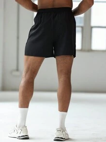 Manfinity Sport Corelite Boyfriend-Stil Herren Grafik Muster Elastische Taille Spalt Saum Sport Shorts, Sommer Schule